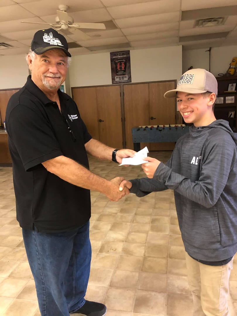Larry presenting a new ham with their CSCE